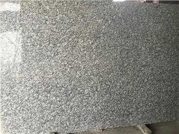 Polvorització de lloses de granit blanc